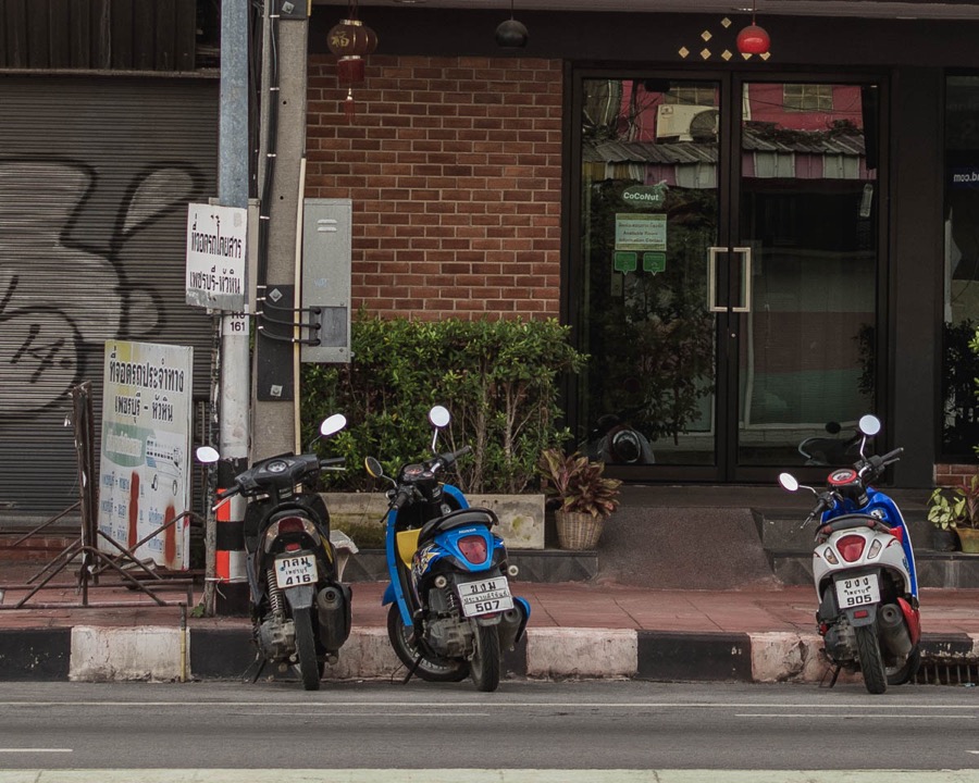 Black-and-white stripes on sidewalk allow parking