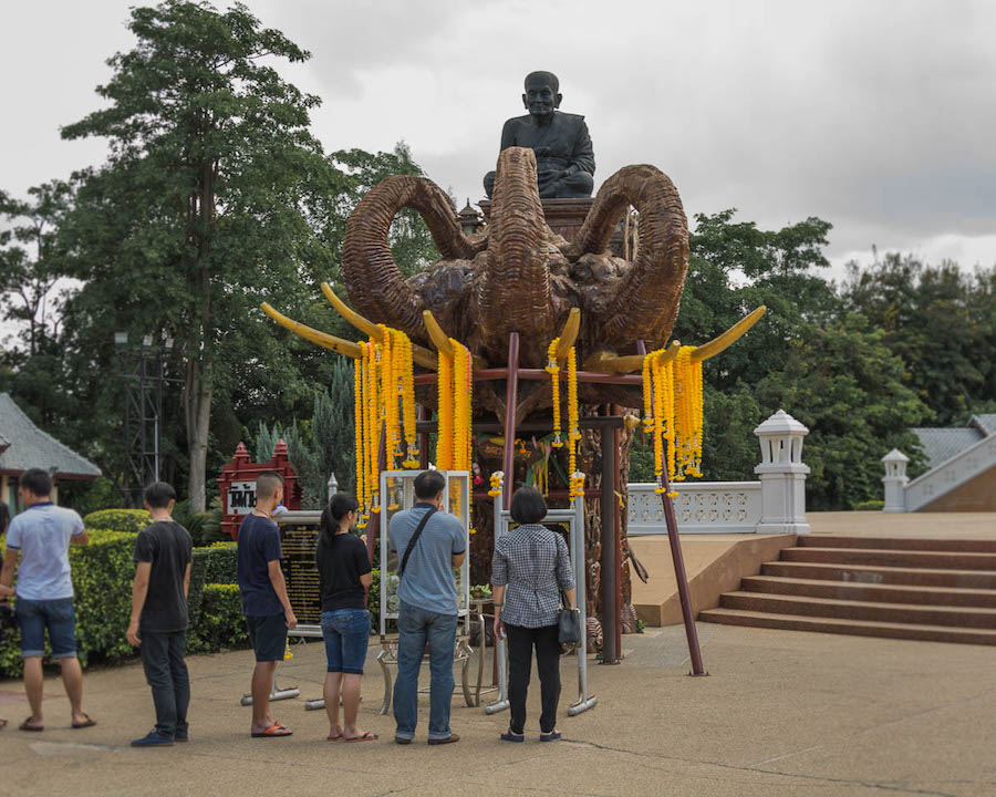 One of the four three-headed elephant statues